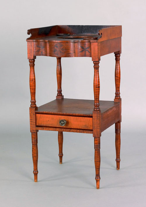 Appraisal: Sheraton tiger maple washstand ca the serpentine front with incised