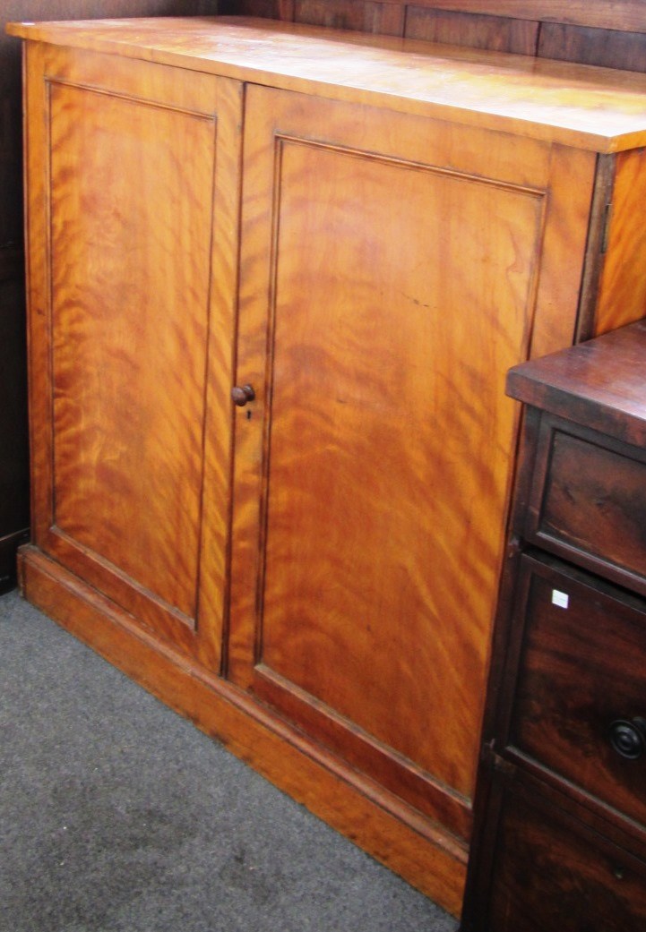 Appraisal: A Victorian satin birch linen press the pair of panelled