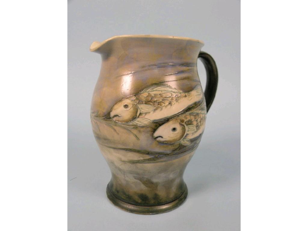 Appraisal: A William Moorcroft salt glaze jug with tube lined decoration