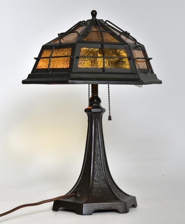 Appraisal: Arts Crafts iron table lamp with amber glass shade h