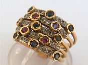 Appraisal: A sapphire ruby emerald and diamond five band ring the