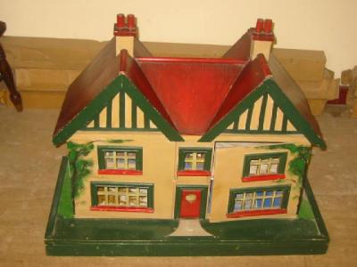 Appraisal: A scratch built dolls house of painted wood construction with