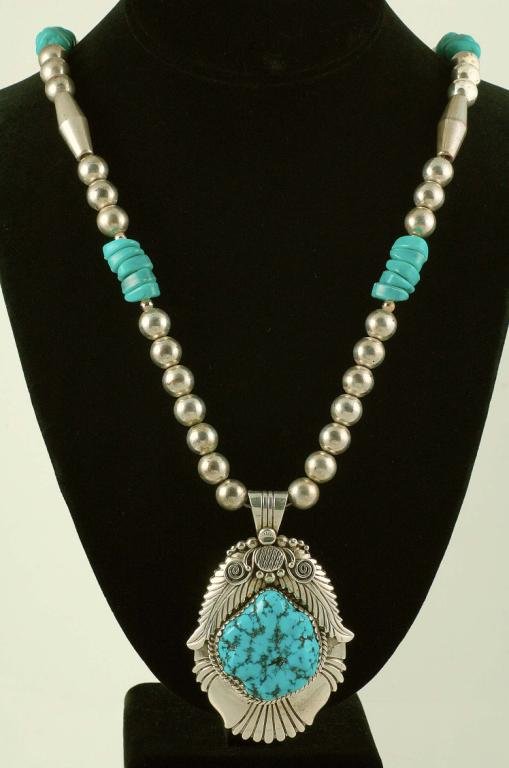 Appraisal: DESCRIPTON A sterling silver Navajo Indian reconstituted turquoise necklace consisting