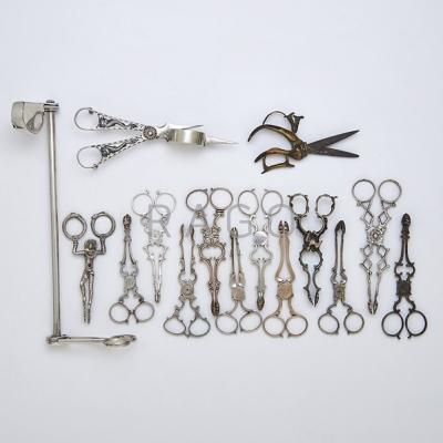 Appraisal: CANDLE SNUFFERS WICK SCISSORS AND SUGAR TONGS Fifteen pieces Old