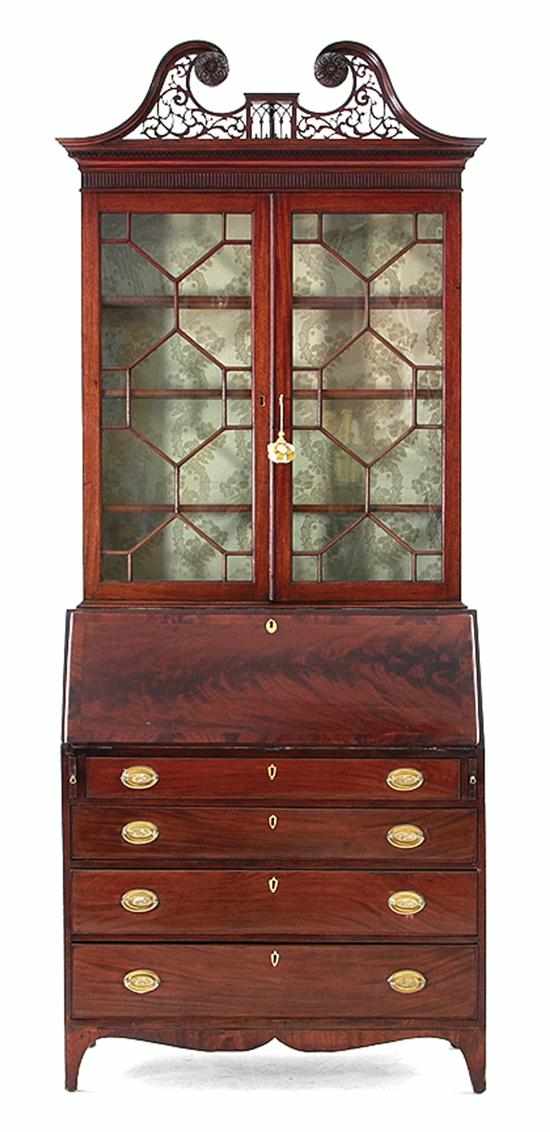 Appraisal: Georgian style carved and inlaid mahogany secretary bookcase circa pierced