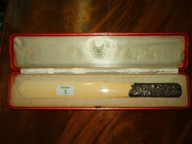 Appraisal: A white metal and ivory page turner the handle decorated