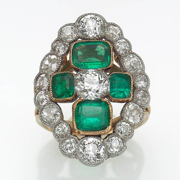 Appraisal: A diamond emerald and platinum-topped gold ring estimated total emerald