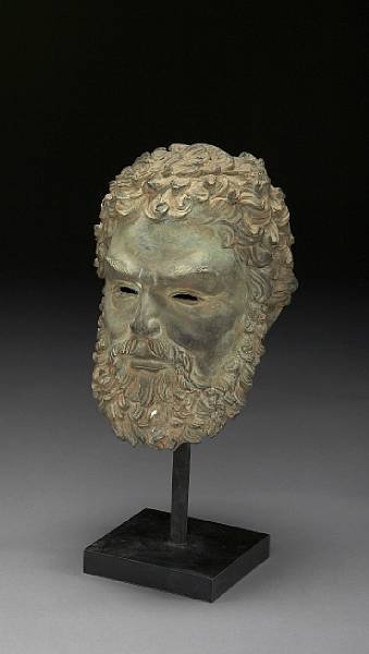 Appraisal: A patinated bronze head of a Classical male after the