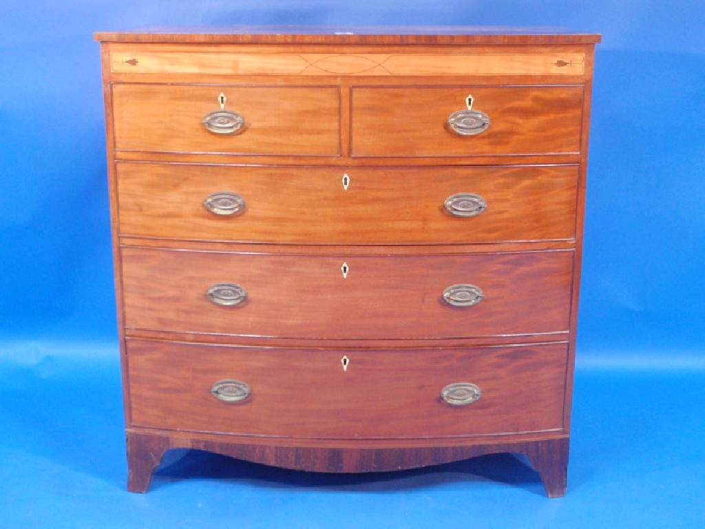 Appraisal: A George III inlaid mahogany bow fronted chest of two