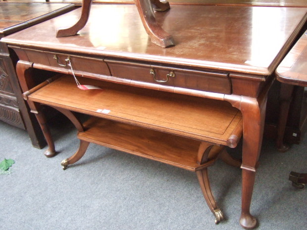 Appraisal: An th century design mahogany side table the rectangular top