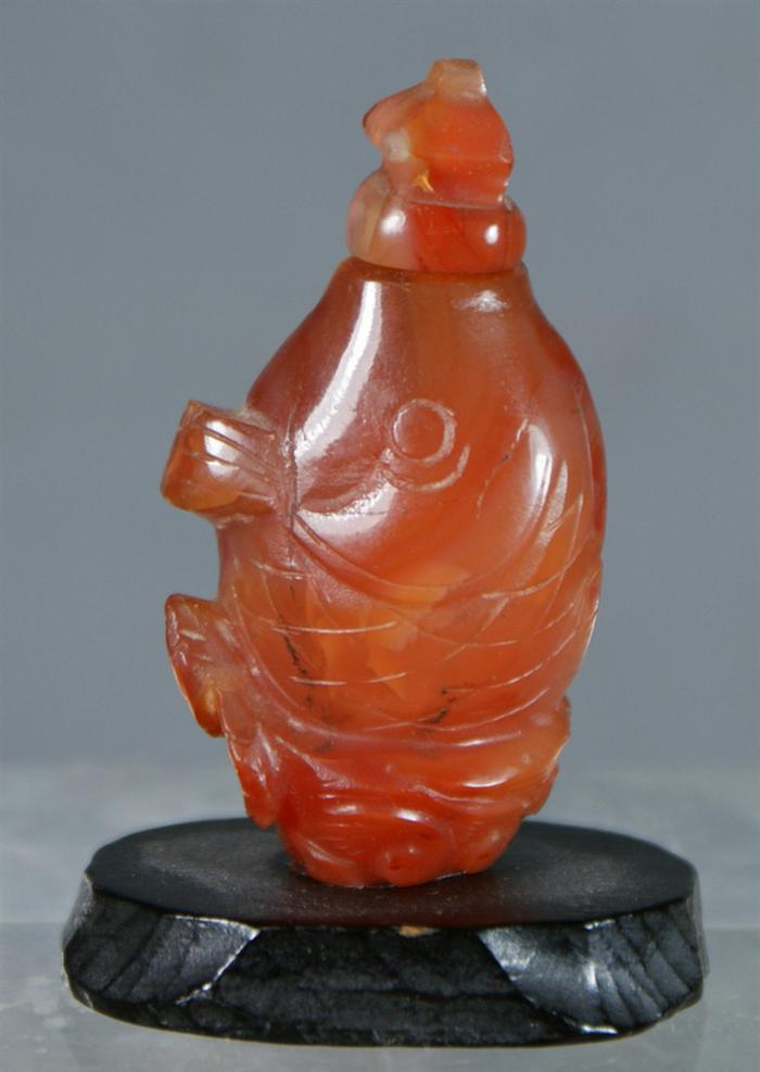 Appraisal: Carved carnelian fish form snuff bottle h Estimate -