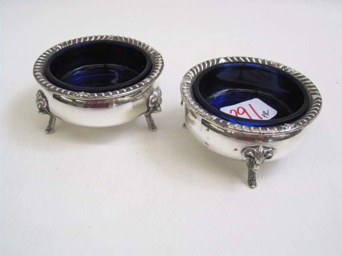 Appraisal: PAIR AMERICAN STERLING SILVER SALTS with cobalt blue glass liners