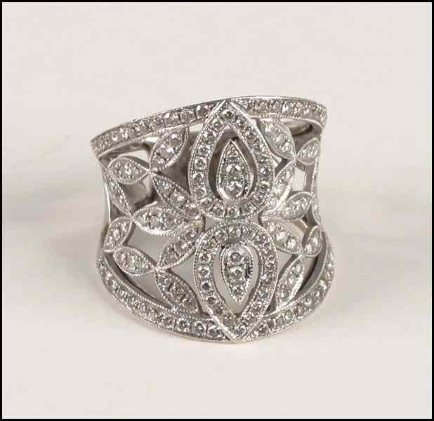 Appraisal: DIAMOND AND KARAT WHITE GOLD FILIGREE RING Round brilliant diamonds