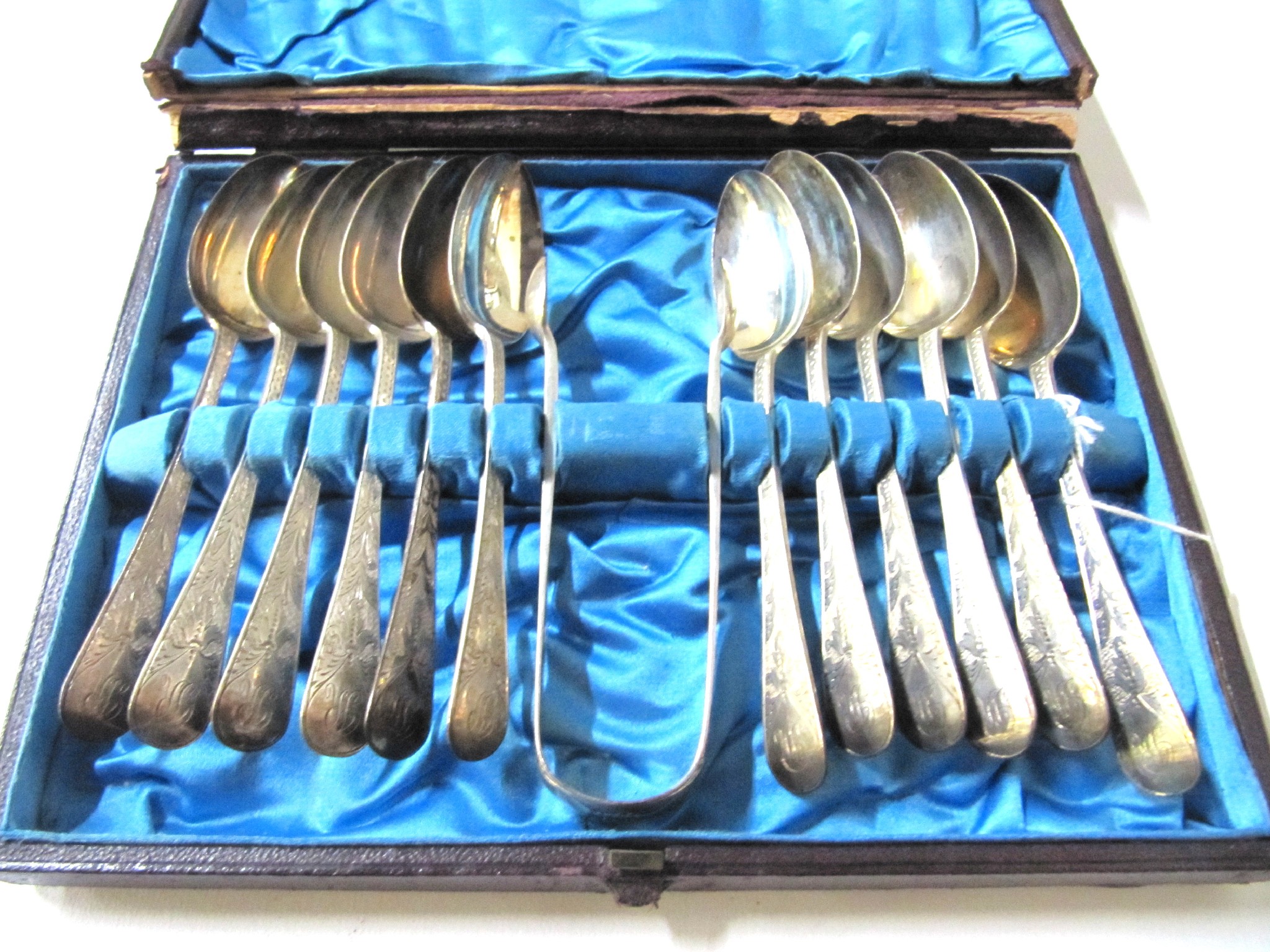 Appraisal: A cased set of twelve silver teaspoons with tongs London