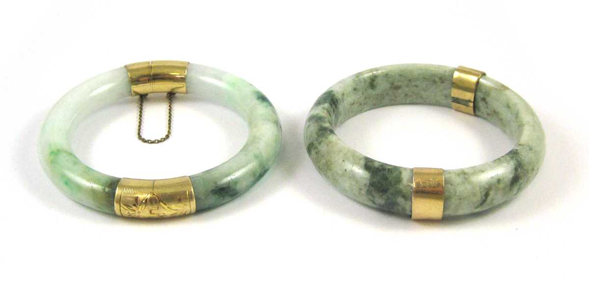 Appraisal: TWO JADE AND FOURTEEN KARAT GOLD BANGLES both round bangles