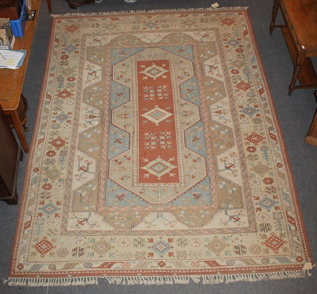 Appraisal: A LARGE PERSIAN STYLE CARPET of cream ground with allover