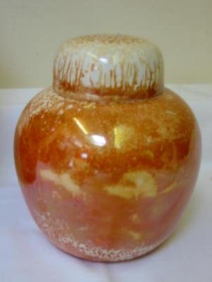 Appraisal: A RUSKIN POTTERY GINGER JAR AND COVER covered in mottled