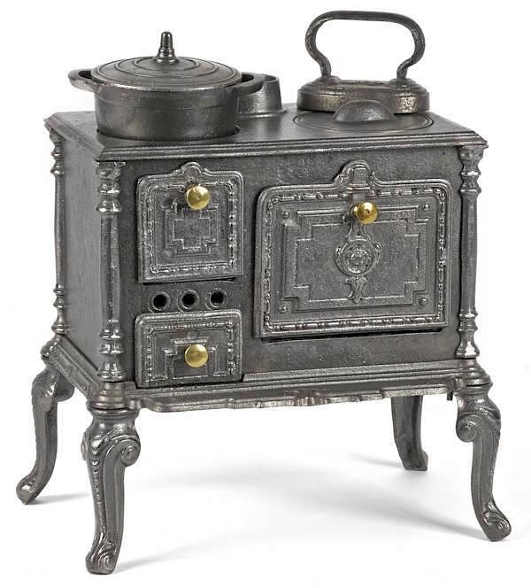 Appraisal: Cast iron toy cook stove embossed with a Cast iron