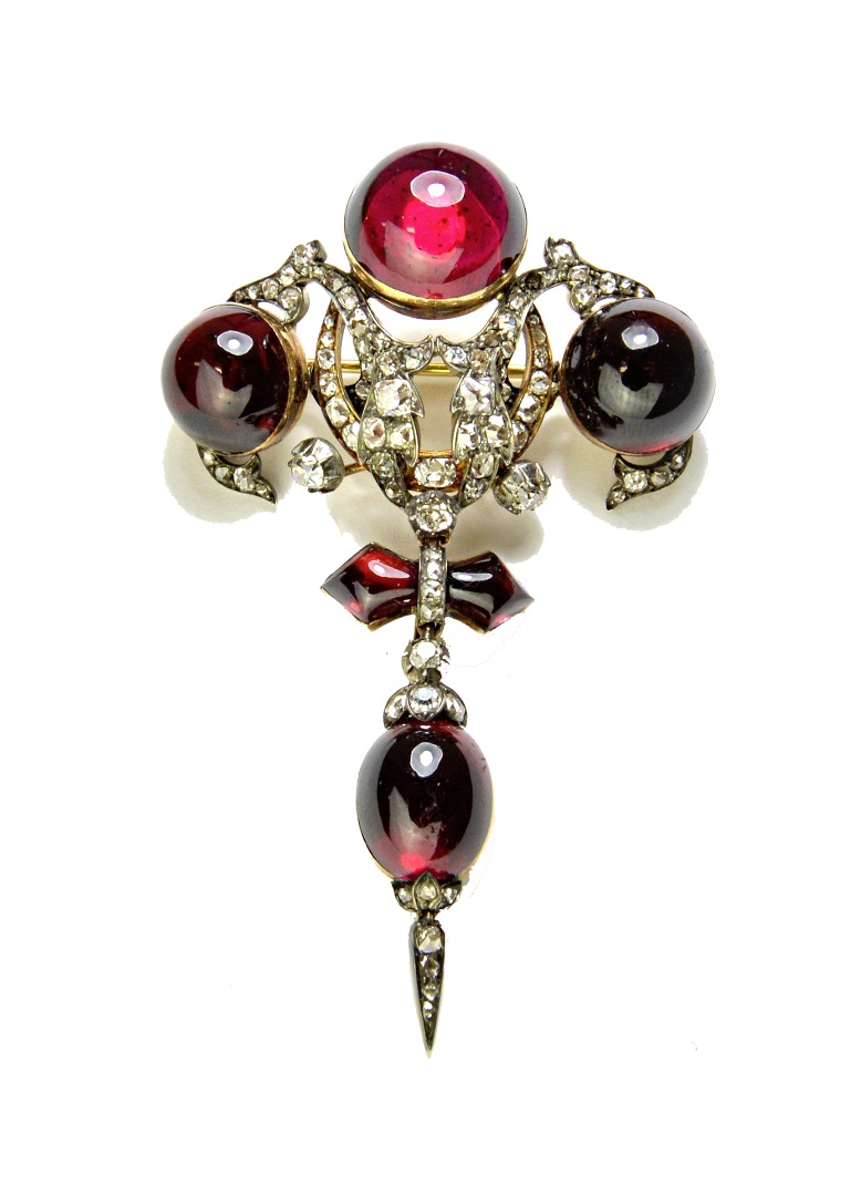 Appraisal: A Victorian diamond and carbuncle garnet set pendant brooch in