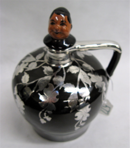 Appraisal: ENGLISH SILVER OVERLAY MUSICAL JUG the stopper the bust of