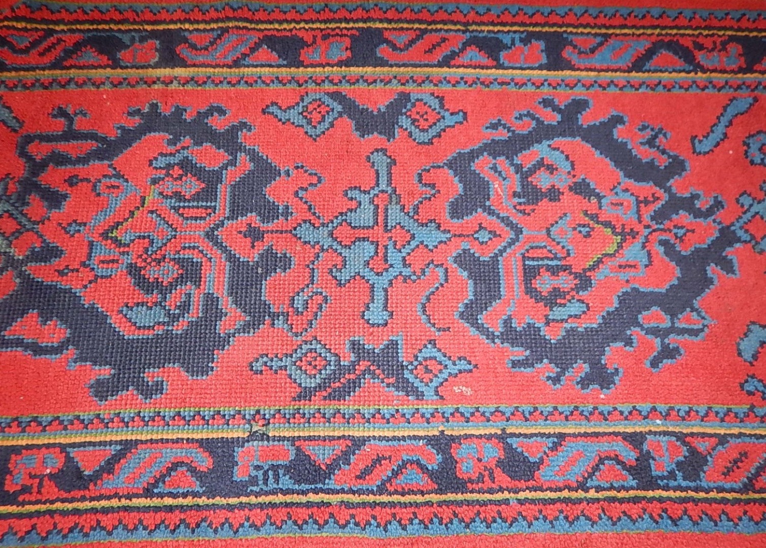 Appraisal: A small Turkish bordered rug cm by cm