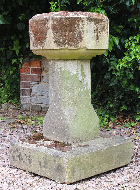 Appraisal: A TH CENTURY STONE FONT with an octagonal bowl inscribed