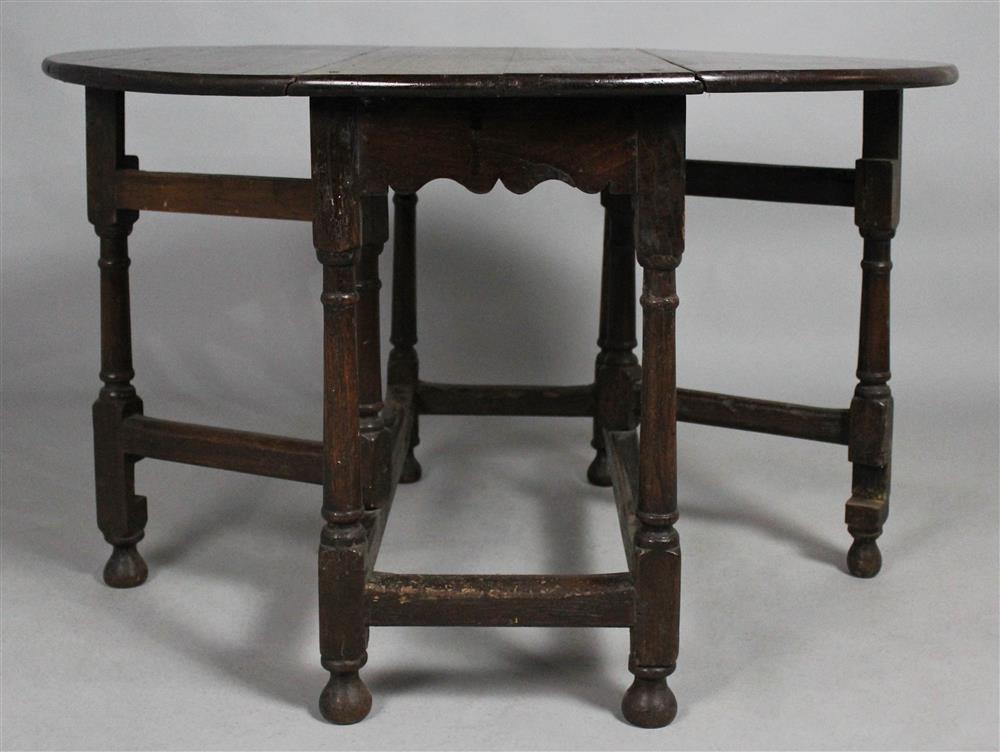 Appraisal: ENGLISH BAROQUE STYLE OAK DROP LEAF TAVERN TABLE h w