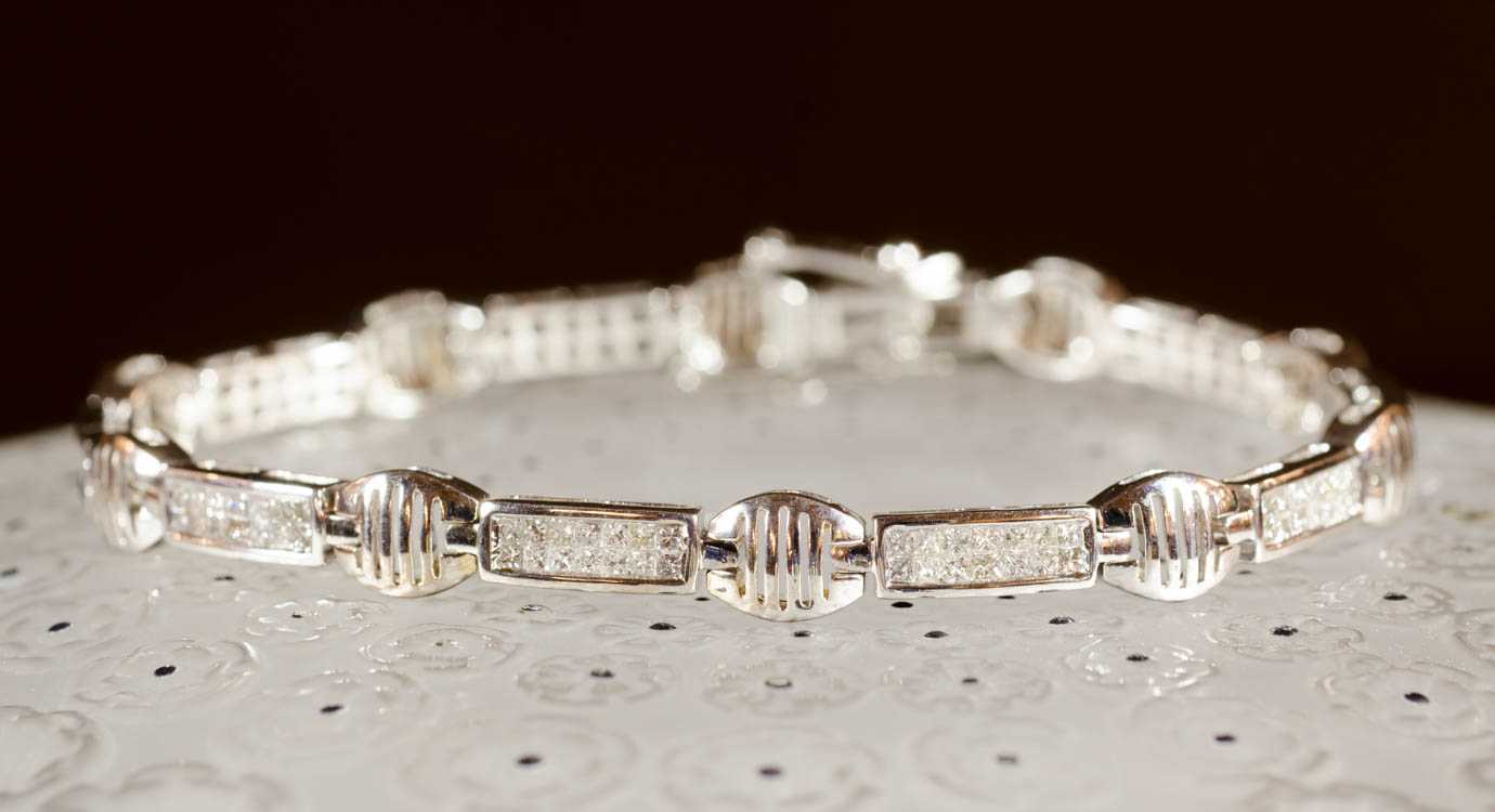 Appraisal: DIAMOND AND FOURTEEN KARAT WHITE GOLD BRACELET measuring - inches