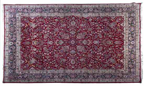 Appraisal: A Persian Wool Rug having a foliate center medallion on