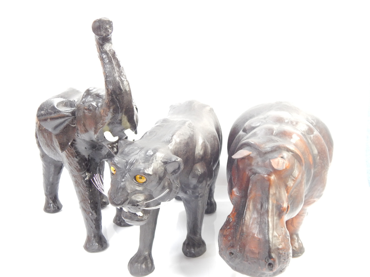 Appraisal: Three leather jungle animals comprising hippopotamus elephant cm high and