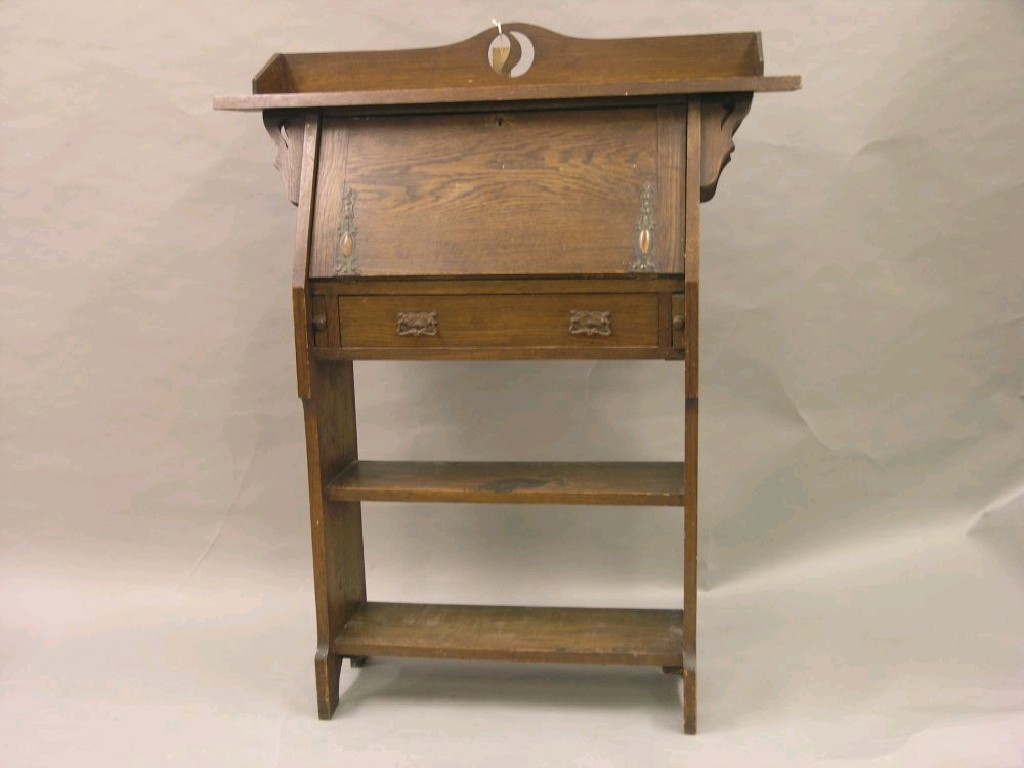 Appraisal: An early th century solid oak student's bureau with embossed