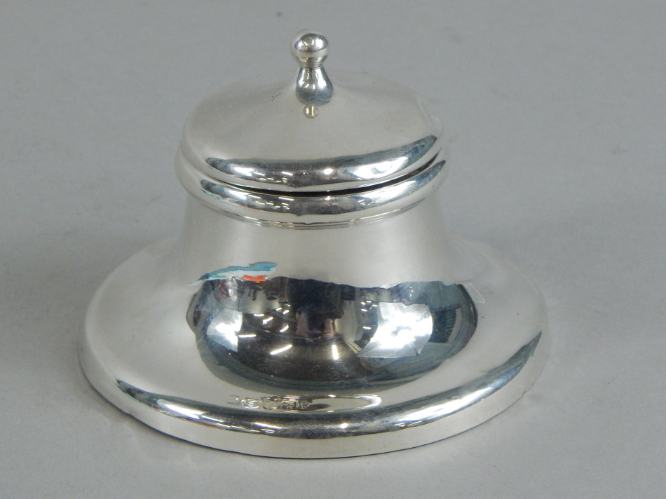 Appraisal: A silver Capstan type inkwell with a hinged lid marks