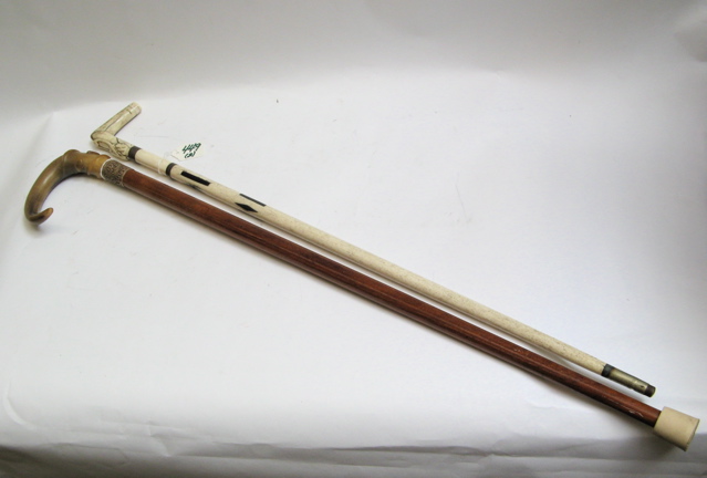 Appraisal: TWO COLLECTIBLE GENTLEMAN'S WALKING CANES the first with handle of