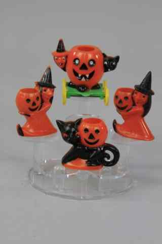 Appraisal: FOUR PLASTIC HALLOWEEN TREAT CONTAINERS Wheeled peek-a-boo witch and cat