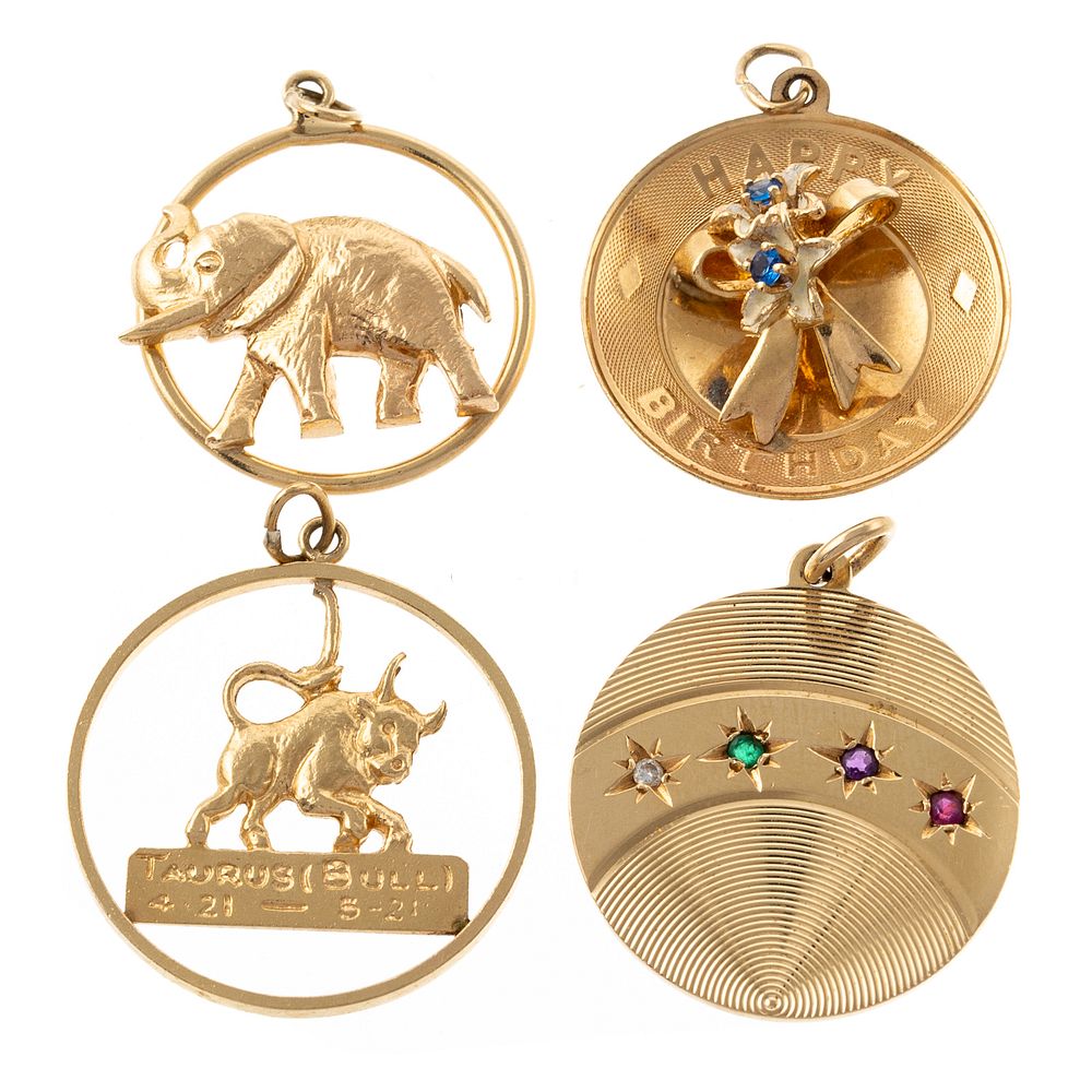 Appraisal: Four Charms in K Yellow Gold K yellow gold elephant