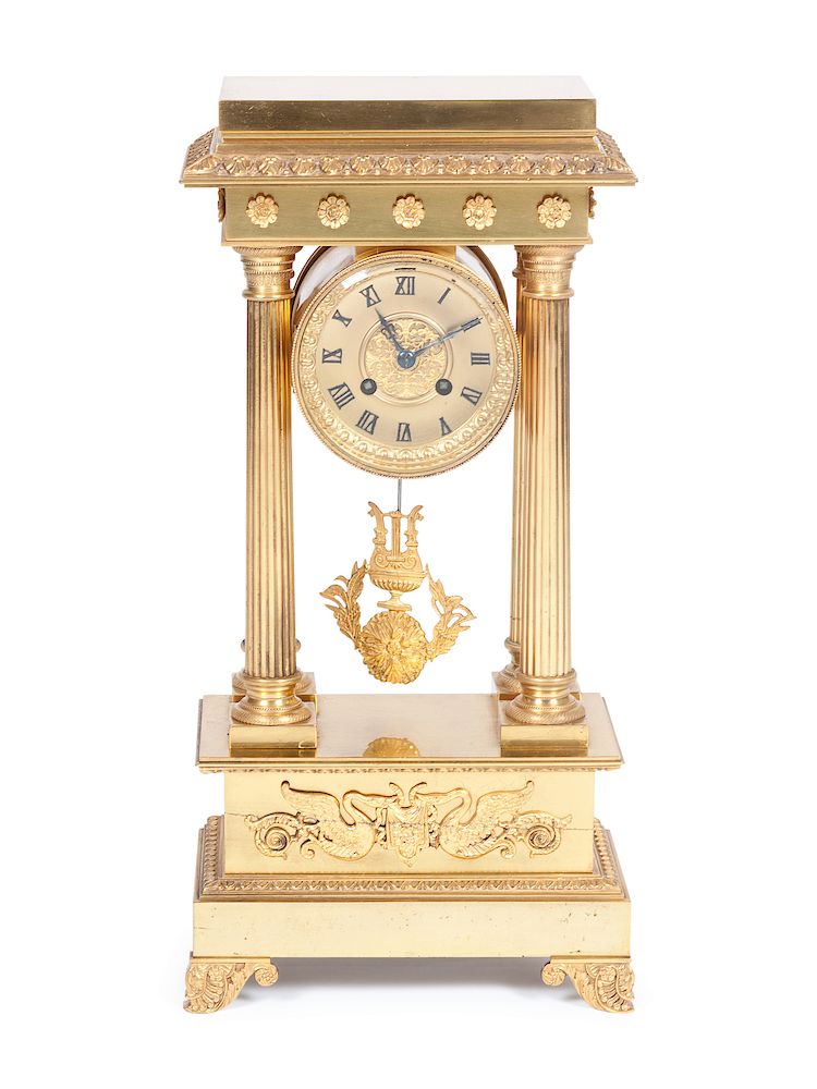 Appraisal: An Empire Style Gilt Bronze Portico ClockHeight x width x