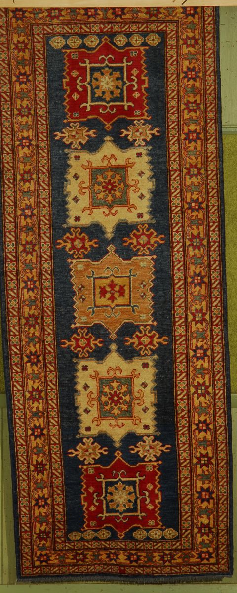 Appraisal: ORIENTAL RUG KAZAK DESIGN ' x ' With five geometric