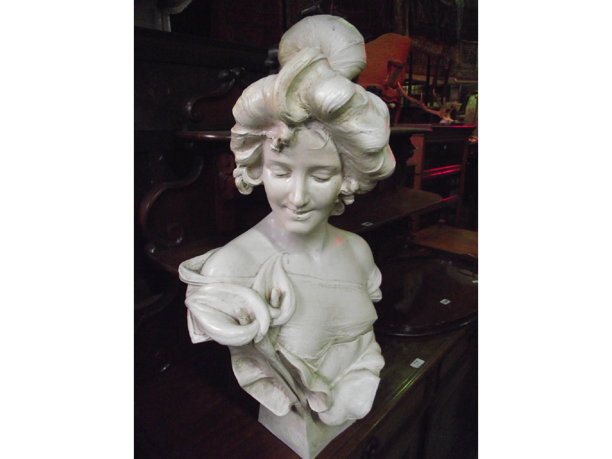 Appraisal: A moulded plaster head and torso bust of an Art