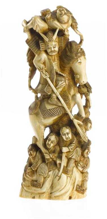 Appraisal: A JAPANESE IVORY CARVING of a mounted warrior trampling his