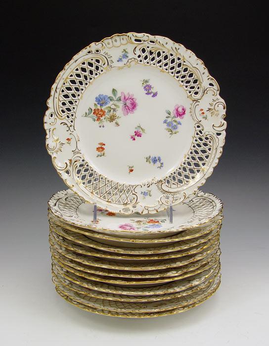 Appraisal: HUTSCHENREUTHER GERMAN RETICULATED PLATES Enhanced transfer floral design with openwork