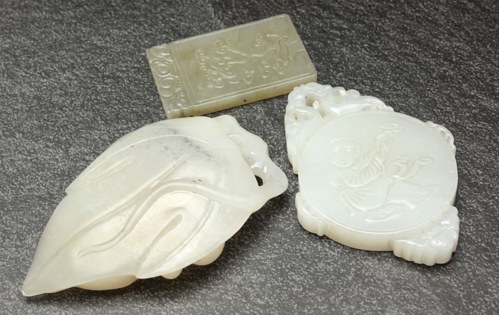 Appraisal: TWO CHINESE JADE PENDANTS AND A CARVING Twentieth century Two