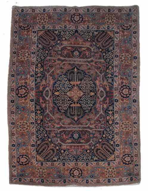 Appraisal: A PERSIAN TABRIZ RUG with a central dark blue medallion