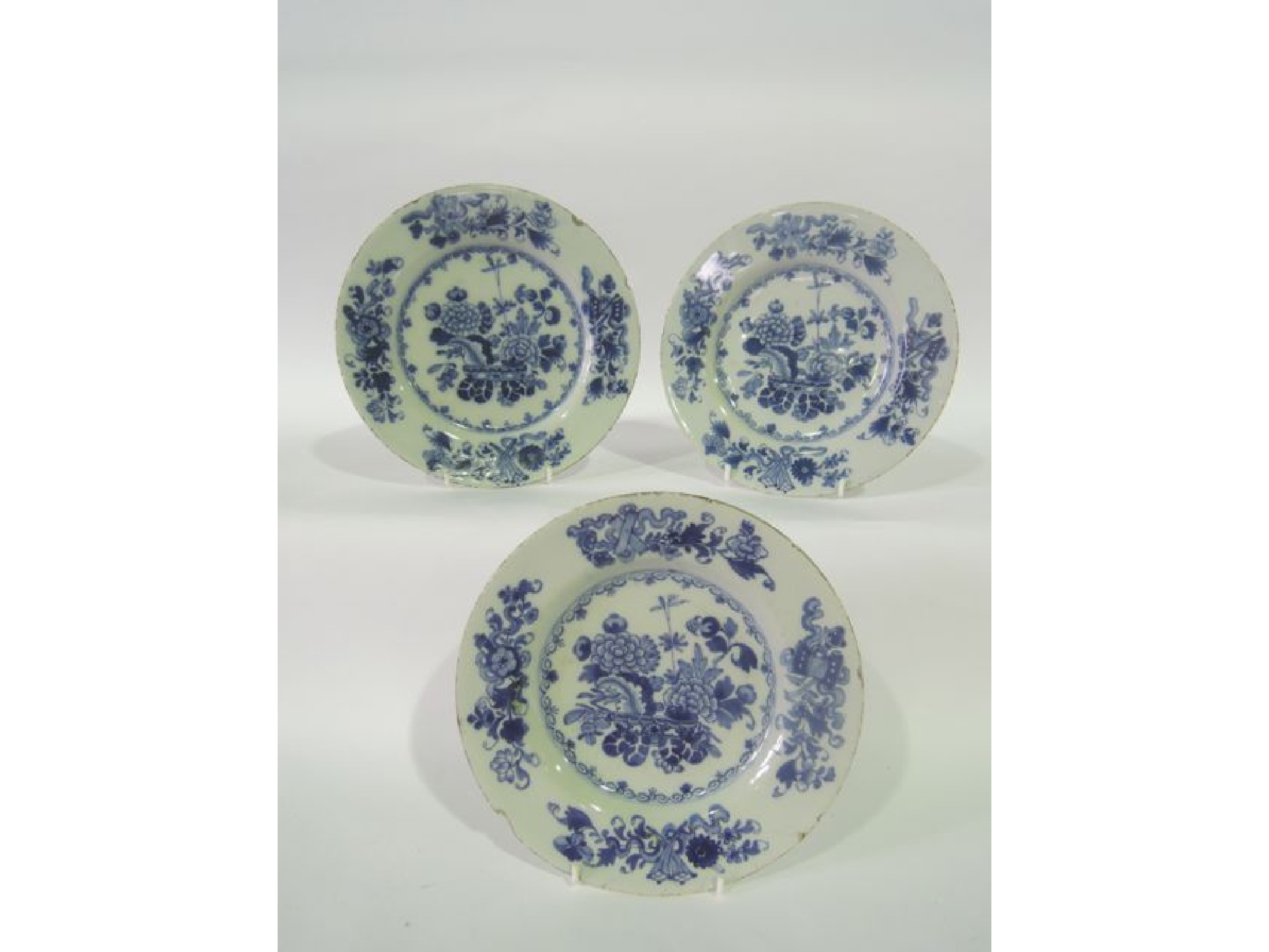 Appraisal: A set of three th century tin glazed earthenware plates