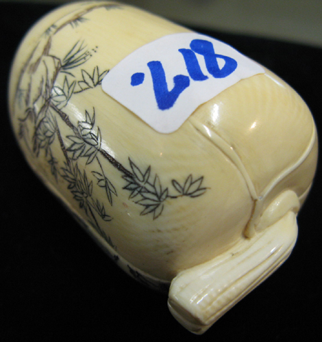 Appraisal: EROTICA AN IVORY HAND CARVED SQUASH with colorful scrimshawed landscape