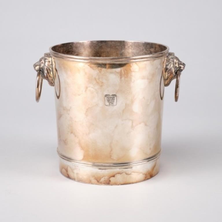 Appraisal: A large silver plated champagne bucket with lion head mounts