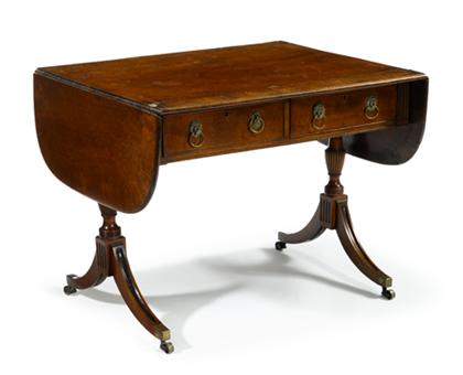 Appraisal: Regency mahogany crossbanded sofa table The rectangular top with D-shaped