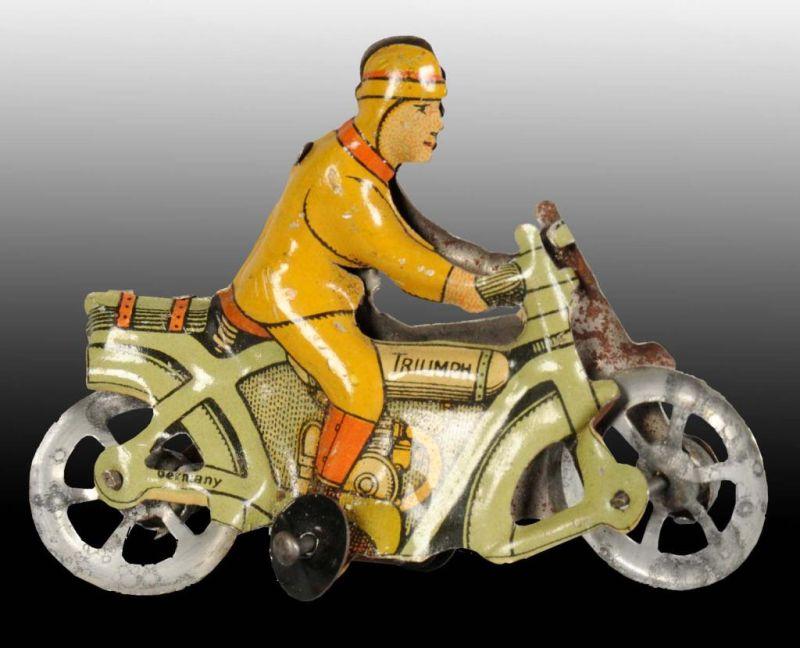 Appraisal: Tin Motorcycle Penny Toy Description German Includes original training wheels