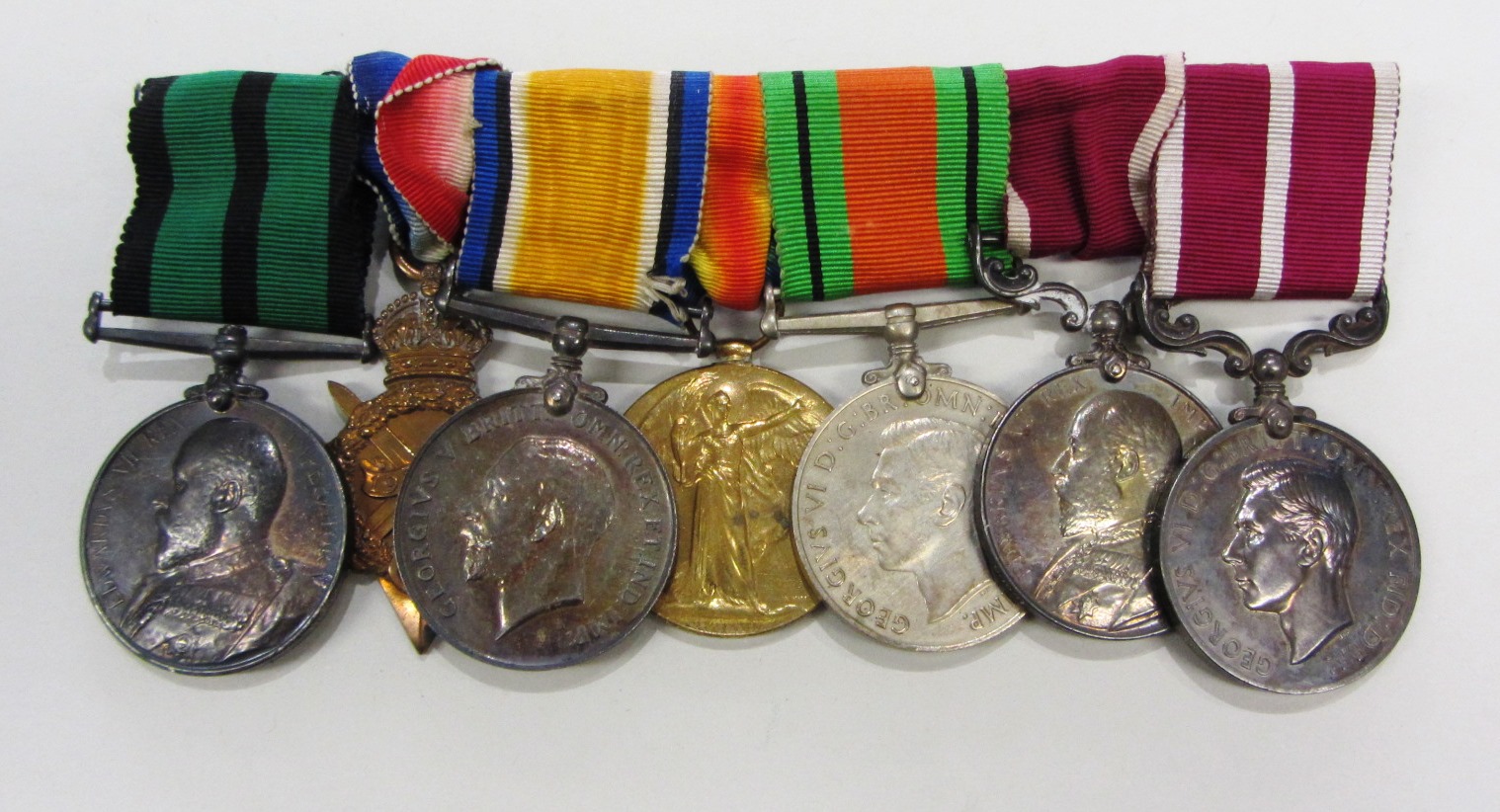 Appraisal: A group of seven medals comprising The Ashanti Medal to