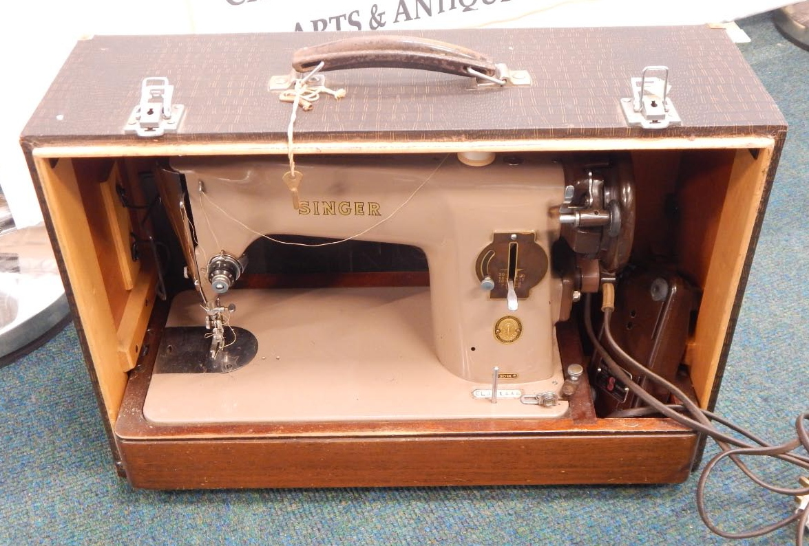 Appraisal: A Singer electric sewing machine in a simulated crocodile skin