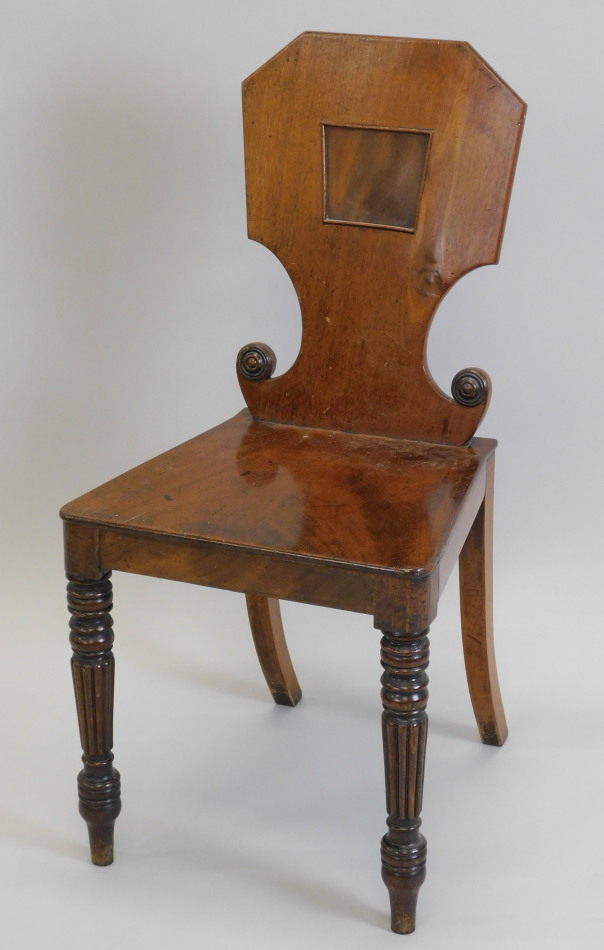 Appraisal: A George IV mahogany hall chair with a shaped panel